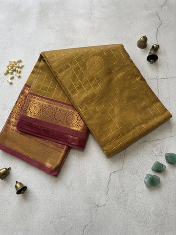 Kanchi silk Saree-with Gold Zari Stripes and Contrast Green Accents